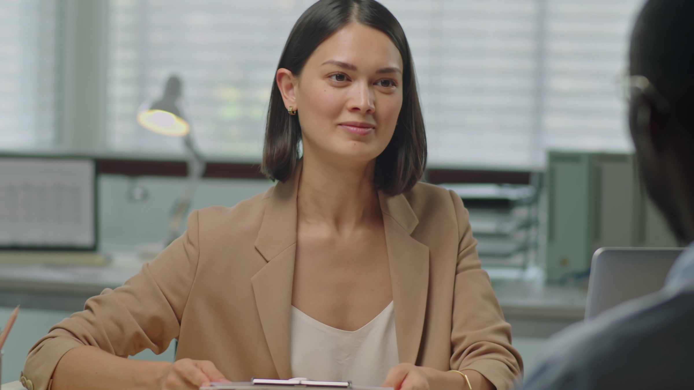 A hiring manager reading applications