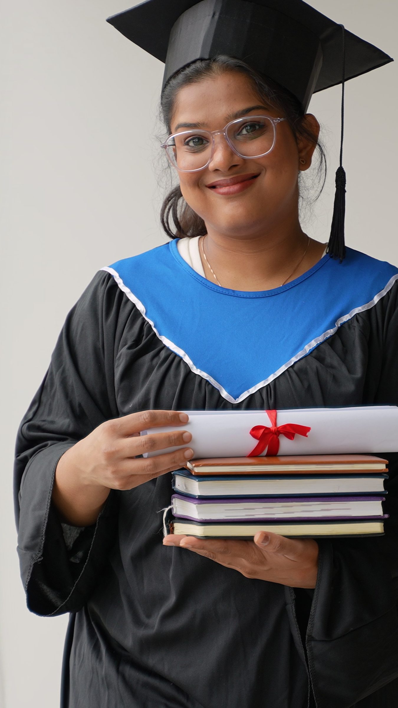 A diploma being held